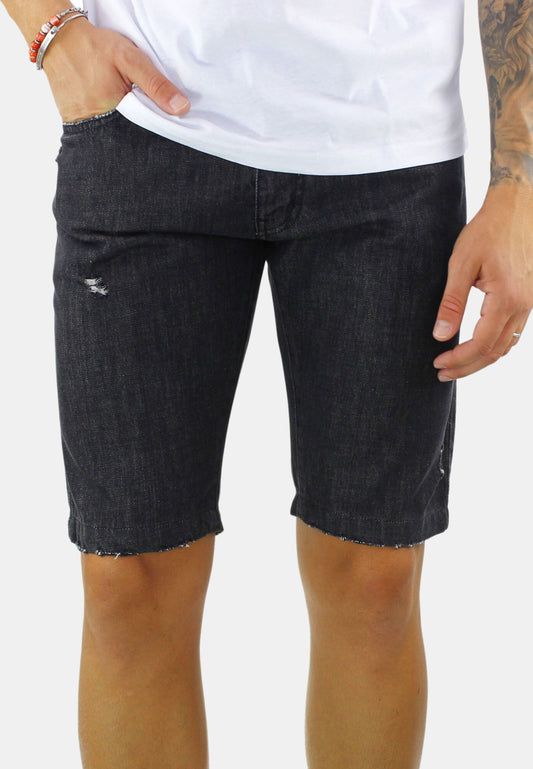 Bermuda shorts in black jeans with rips